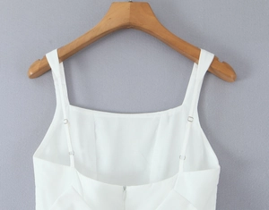 Close-up of the white princess dress back with an invisible zipper and delicate straps