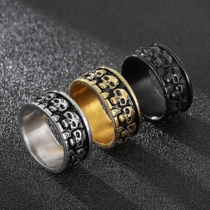 Three-color set of gothic skull carved stainless steel rings in silver, gold, and black
