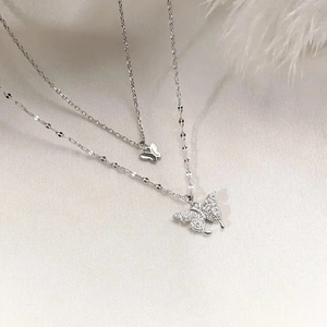 Double-layered butterfly necklace with pavé cubic zirconia pendants in silver finish