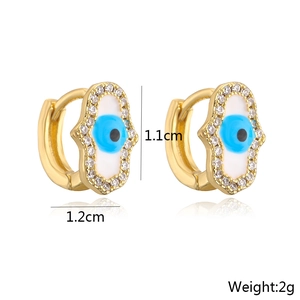 Detailed view of 18K gold plated Hamsa hand earrings with blue eye and measurements