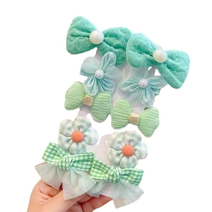 Cute mint green floral and bow hair clips set for girls featuring pearls and lace