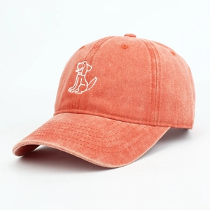 Vintage washed cotton baseball cap featuring white dog embroidery and adjustable soft top