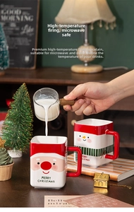 Close-up of heat-resistant ceramic Santa Claus mugs with large red C-shaped handles