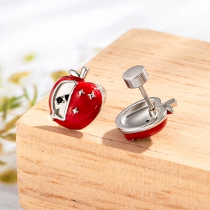 Sweet red apple stud earrings in titanium steel with black gemstone on wood base