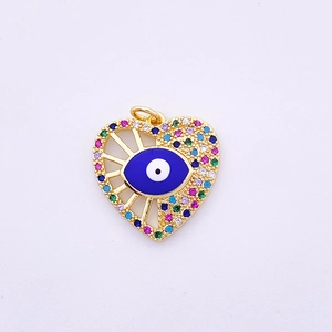 Detailed close-up of heart-shaped evil eye pendant with colorful zircon stones on gold base