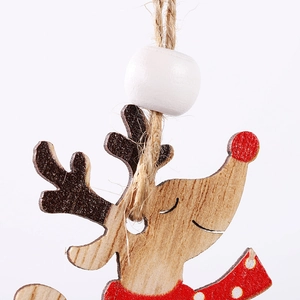 Close-up of wooden Christmas reindeer pendant with red nose and natural jute rope
