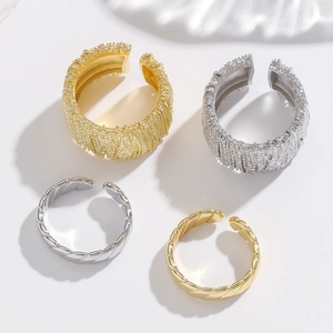 Adjustable copper rings in gold and silver with hammered texture and twisted rope designs