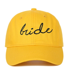 Yellow cotton baseball cap featuring black bride embroidery script on white background