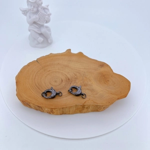 Gunmetal lobster clasp with micro-paved cubic zirconia on natural wood slice decoration