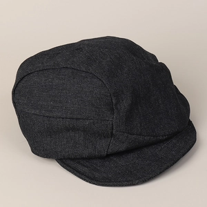 Detail of the textured black denim fabric and stitching on this pleated newsboy cap