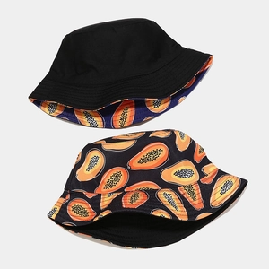 Reversible bucket hat with tropical papaya fruit print and solid black cotton design