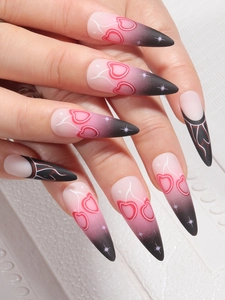 Long stiletto press-on nails featuring matte pink black gradient and cherry patterns