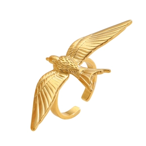 Detailed view of golden metal bird ring showing intricate feather textures and open band