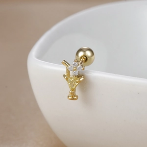 Macro shot of 18K gold plated cocktail glass stud earring with yellow zircon and screw back