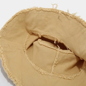 Frayed edge khaki canvas bucket hat with a vintage washed cotton wide brim for outdoors