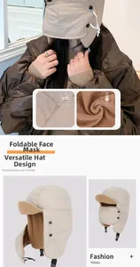 Detail of beige thermal bomber hat featuring windproof shell and cozy fleece lining