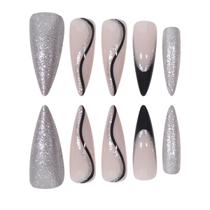 Long stiletto press-on nails with silver glitter and black French wave line patterns