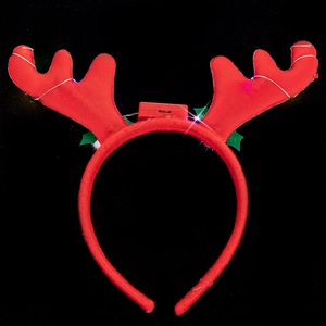Detail of red reindeer antler headband with glowing LED lights and manual power switch