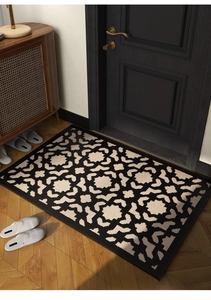 Detailed top view of geometric polypropylene entrance mat on light wood flooring