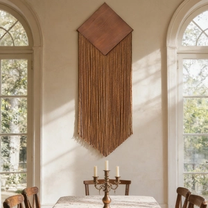 Bohemian wall hanging with dark brown cotton tassels on diamond wooden board