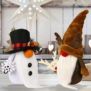 Christmas gnomes set with reindeer antlers and snowflake accessory on wooden table