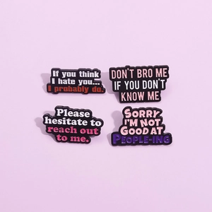 Set of four cute enamel pins with witty English slogans on a soft pink background