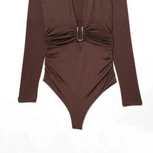 Brown long sleeve deep V-neck bodysuit with a gold U-buckle and elegant pleated waist