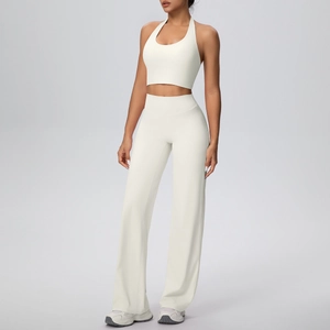 Detail of cream halter neck sports bra and wide-leg yoga pants set for fitness