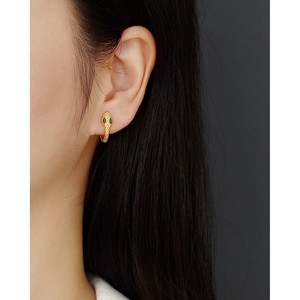 Luxurious S925 sterling silver snake hoop earring with green eye details on model
