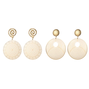 Vintage gold hollow round earrings with intricate filigree and hammered metal textures