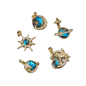 Starry sky cosmic gold pendants with blue enamel and micro-set cubic zirconia
