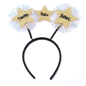 Macro shot of Happy New Year gold glitter star headband with spring accents and colorful tinsel
