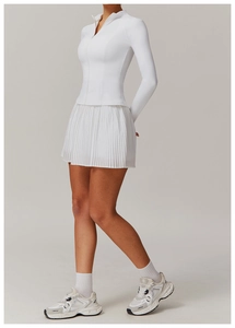 Detailed look of white long-sleeved zipper top and pleated tennis skirt sports set