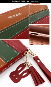 Detail of tricolor leather wallet featuring tassel, rabbit charm and zipper pockets
