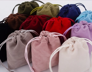 Close-up of colorful velvet drawstring pouches showing soft texture and varied hues