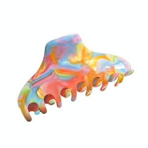Large colorful acetate hair claw clip with rainbow marble texture for women