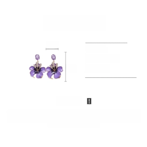 Detail view of purple floral earrings with rhinestones showing 4cm width and 6cm height