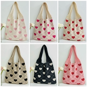 Collage of knit heart tote bags in various colors including beige, black and pink
