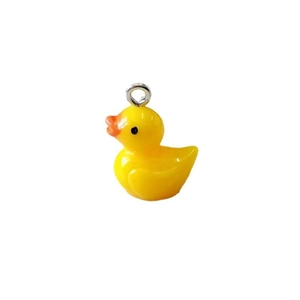 Detailed close-up of a yellow resin duck pendant with a metal ring for DIY jewelry making