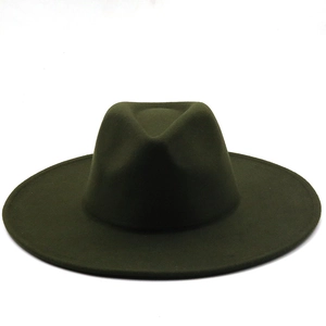 Detail shot of the wide flat brim and indented crown on a dark olive wool fedora hat