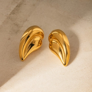 Minimalist 18k gold plated stainless steel teardrop heart earrings on stone surface