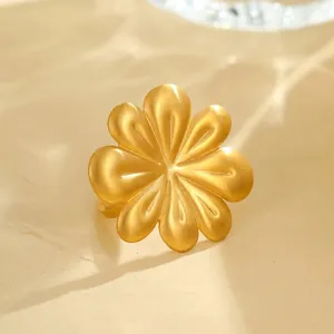 Macro shot of 3.65cm golden brushed petal ring with detailed size and weight measurements