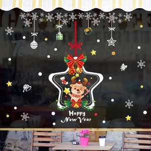 Detailed view of festive Christmas snowflake and cartoon reindeer stickers on a glass window