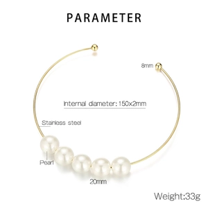 Detail of gold stainless steel choker featuring five 20mm pearls and open-ended spheres