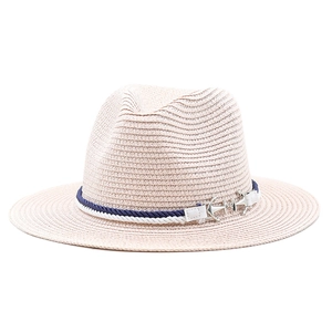 Detail of light pink straw panama hat featuring blue white rope and silver anchor buckle