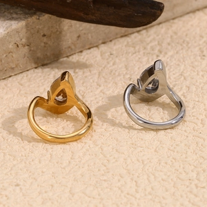 Detail view of pear-cut white rhinestones on 18K gold and silver plated teardrop rings