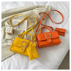 Flat lay of candy-colored leather flap bags with matching coin purses and straps