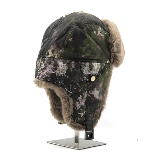 Detail showing camouflage windproof fabric and thick plush lining of the trapper hat