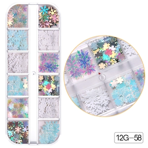Detail of 12-grid snowflake nail art sequins in various colors for Christmas manicures