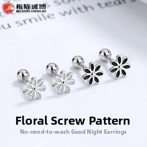 Macro detail of 925 sterling silver daisy stud earrings with secure screw ball back closure